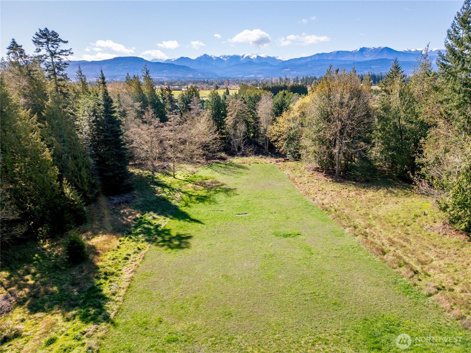 193 Snowberry Lane Sequim, WA 98382 - Photo 3 of 40 a view of a lake with a mountain in the background