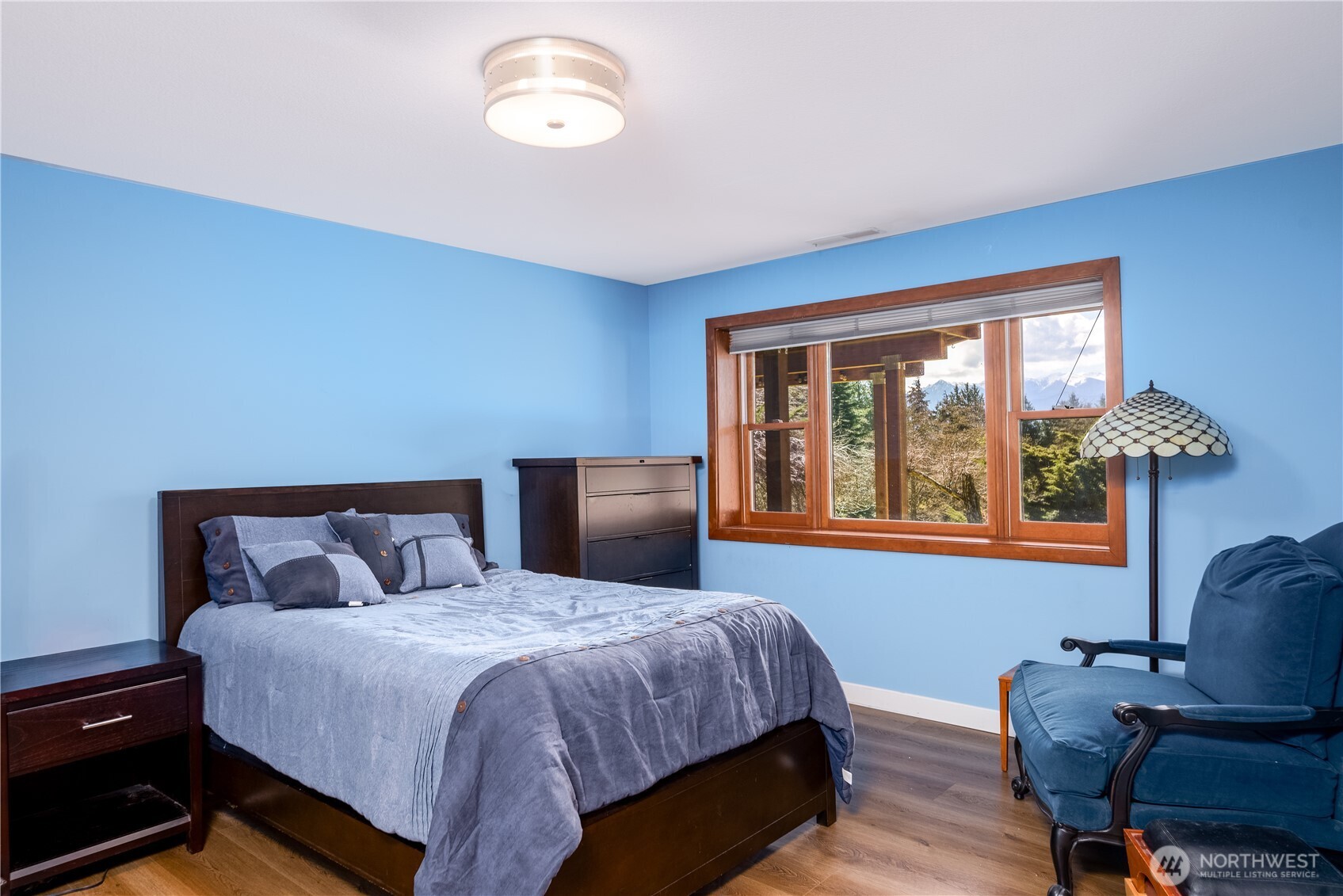 193 Snowberry Lane Sequim, WA 98382 - Photo 34 of 40 a bedroom with a bed gym equipment and a window