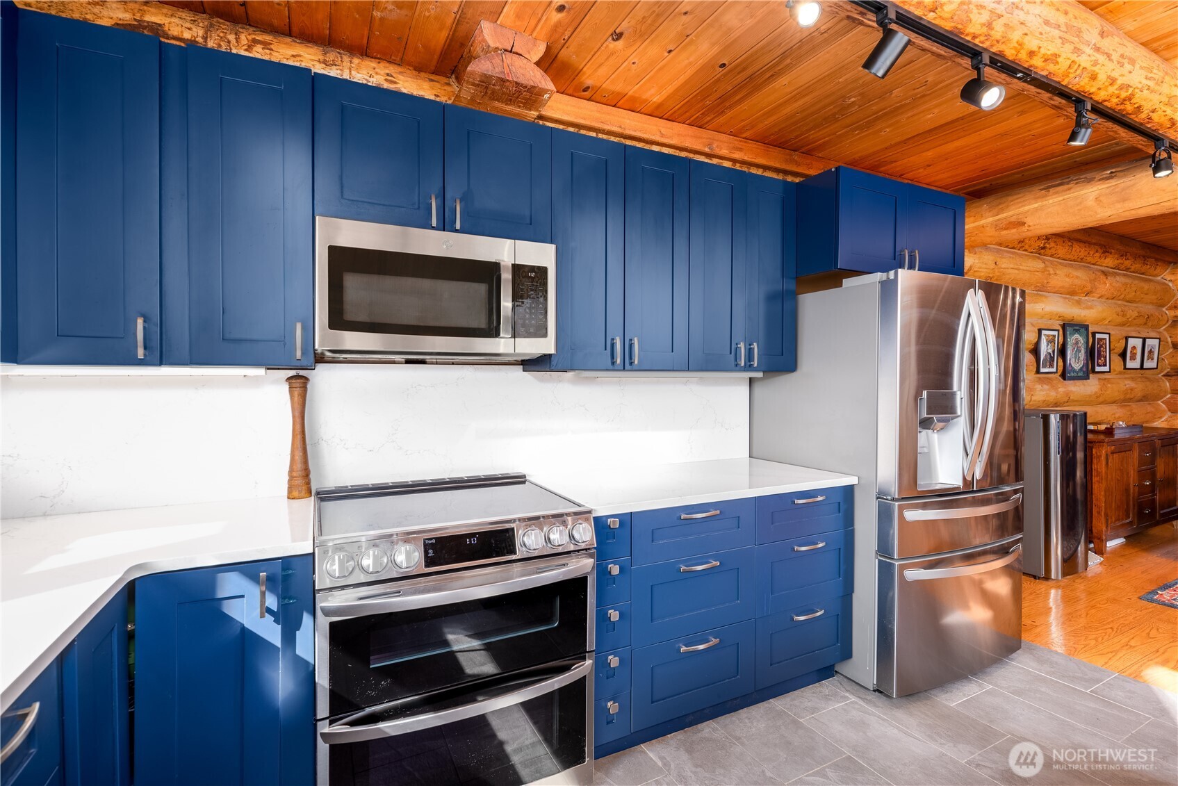193 Snowberry Lane Sequim, WA 98382 - Photo 8 of 40 a kitchen with stainless steel appliances a stove a microwave and a refrigerator