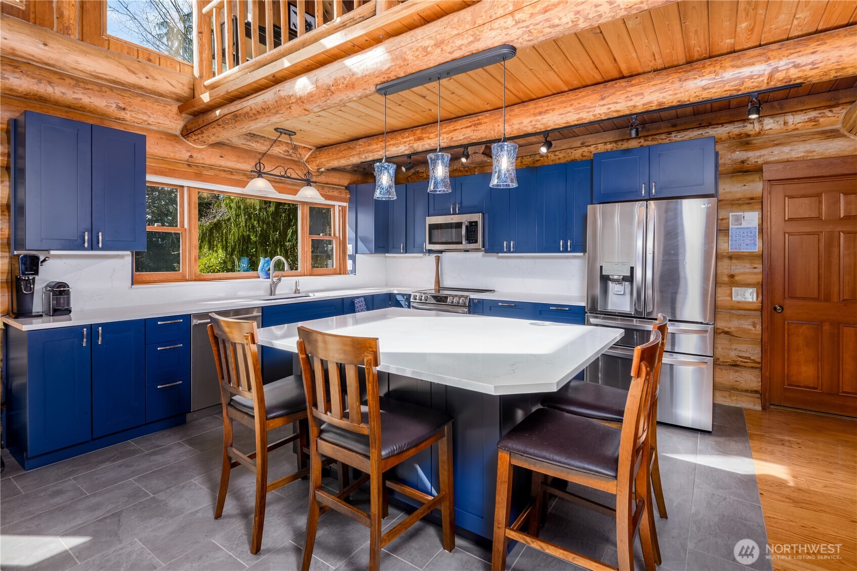 193 Snowberry Lane Sequim, WA 98382 - Photo 9 of 40 a dining table with chairs and cabinets