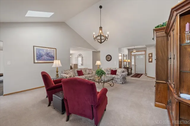a view of a livingroom with furniture and a window