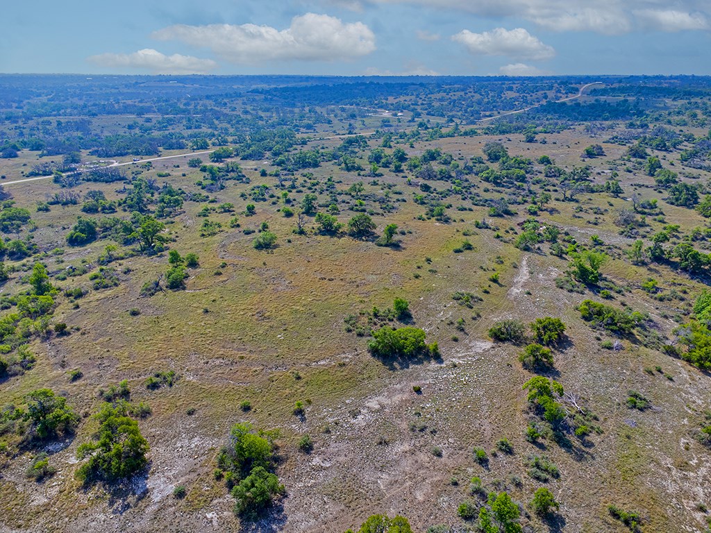 0 Maner Road Fredericksburg, TX 78624 - Photo 11 of 26 an aerial view of house with yard and mountain view in back