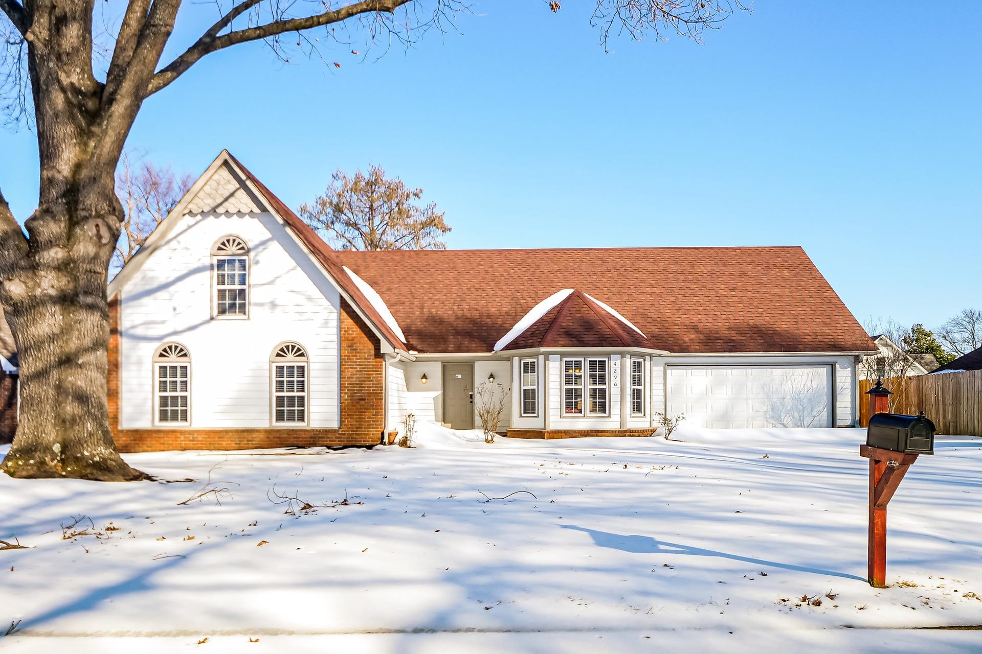 4290 Timber Jump Cove Memphis, TN 38141 - Photo 15 of 17 a house with trees in the background
