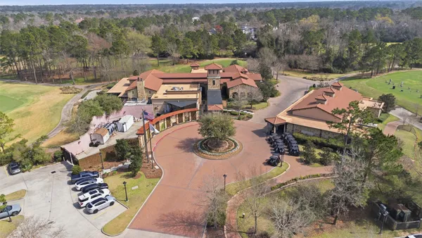 an aerial view of a house with outdoor space and lake view