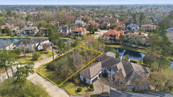 an aerial view of a house with a swimming pool