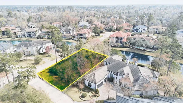 aerial view of a house with a yard