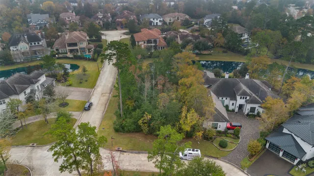 an aerial view of houses with yard