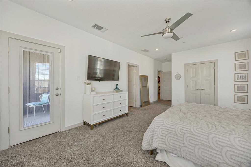 1650 Jessica Lane Allen, TX 75002 - Photo 20 of 25 a spacious bedroom with a bed and a flat screen tv