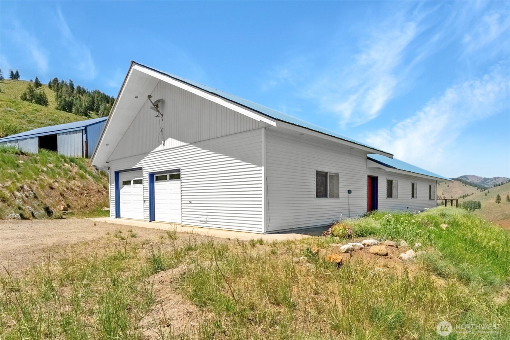 427 Rendezvous Road Winthrop, WA 98862 - Photo 2 of 40 a view of a house with a yard