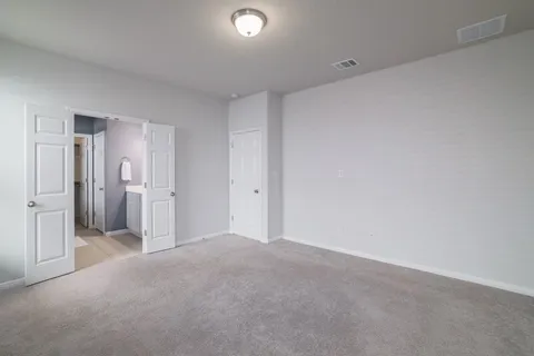 a bathroom with a double vanity sink mirror and shower