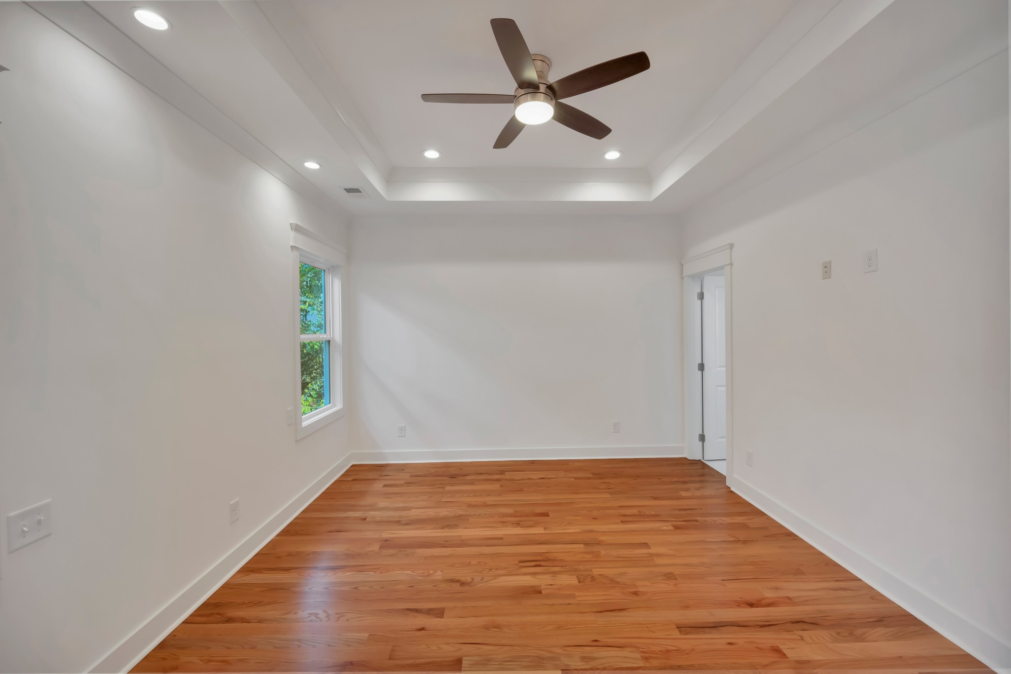 520 Croley Drive, Unit A (RIGHT SIDE) Nashville, TN 37209 - Photo 23 of 39 a view of an empty room with window and wooden floor