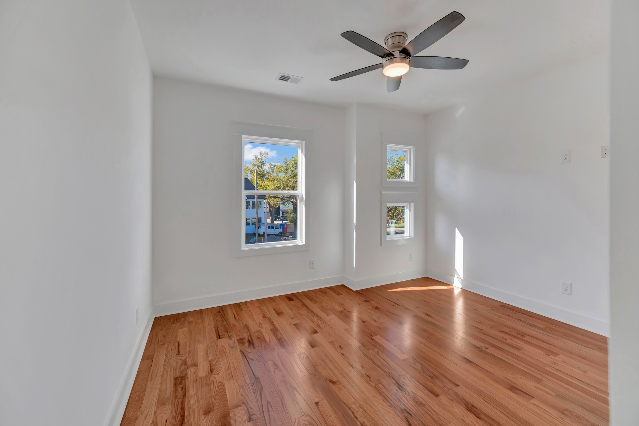 520 Croley Drive, Unit A (RIGHT SIDE) Nashville, TN 37209 - Photo 34 of 39 a view of an empty room with window and wooden floor