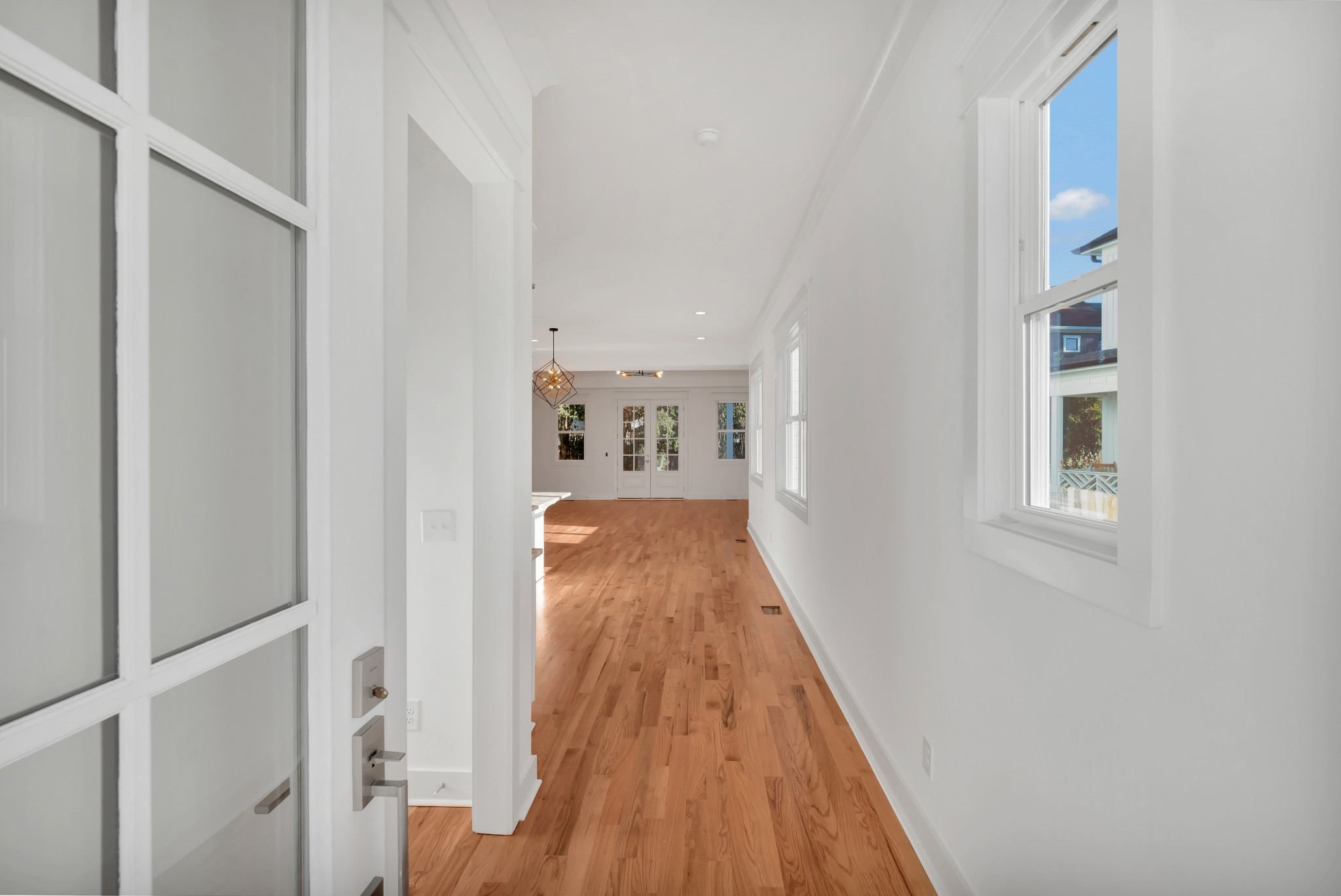 520 Croley Drive, Unit A (RIGHT SIDE) Nashville, TN 37209 - Photo 5 of 39 a view of a hallway with wooden floor and a bathroom