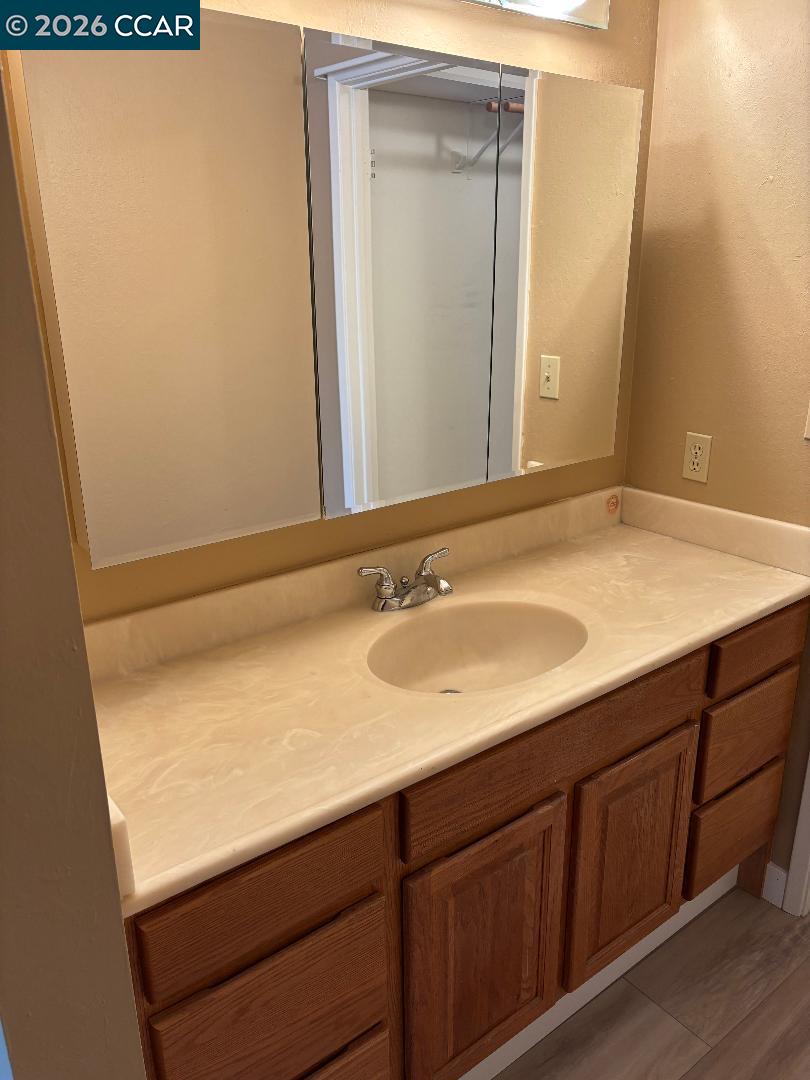 5460 Concord Boulevard, Unit B7 Concord, CA 94521 - Photo 14 of 20 a bathroom with a sink and a mirror