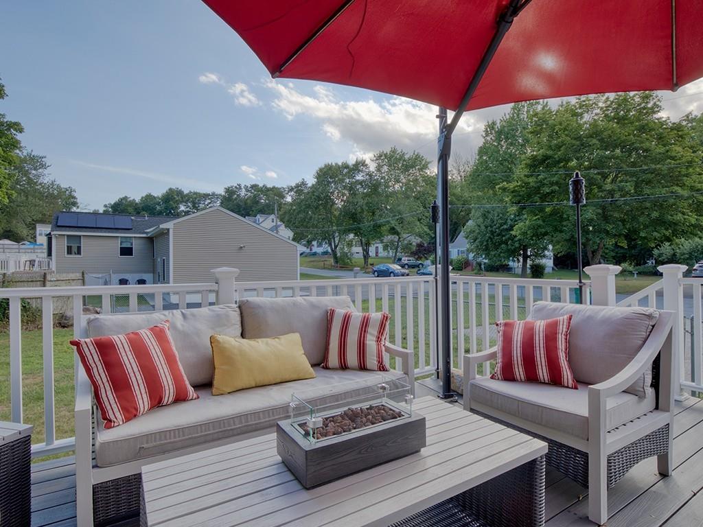 645 Boston Road Billerica, MA 01821 - Photo 4 of 18 a roof deck with couches and umbrella
