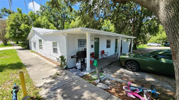 front view of a house with a yard