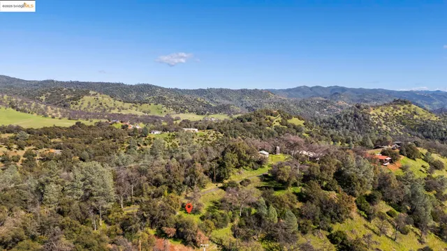 a view of a town with mountains in the background