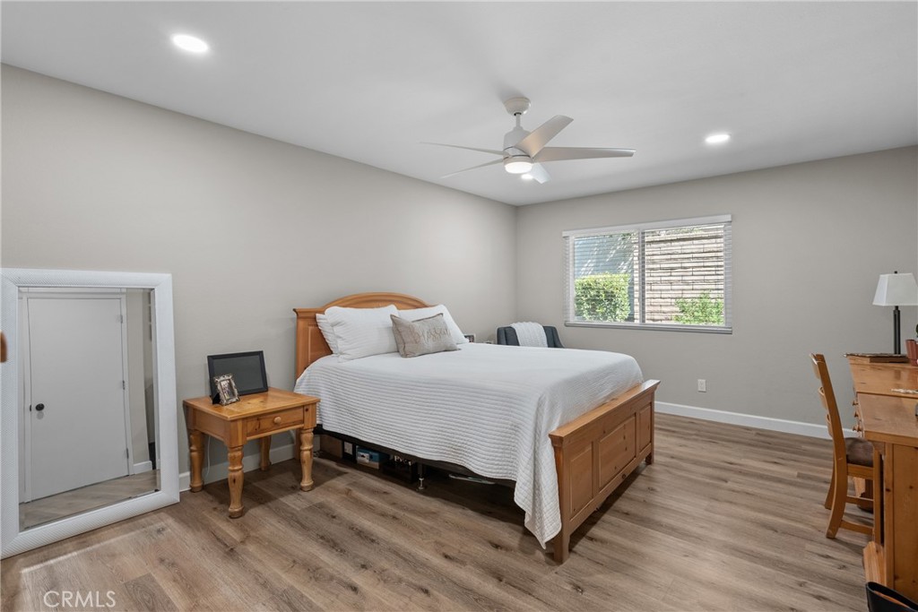 28818 Oak Springs Canyon Road Canyon Country, CA 91387 - Photo 13 of 38 a spacious bedroom with a bed and a table in it