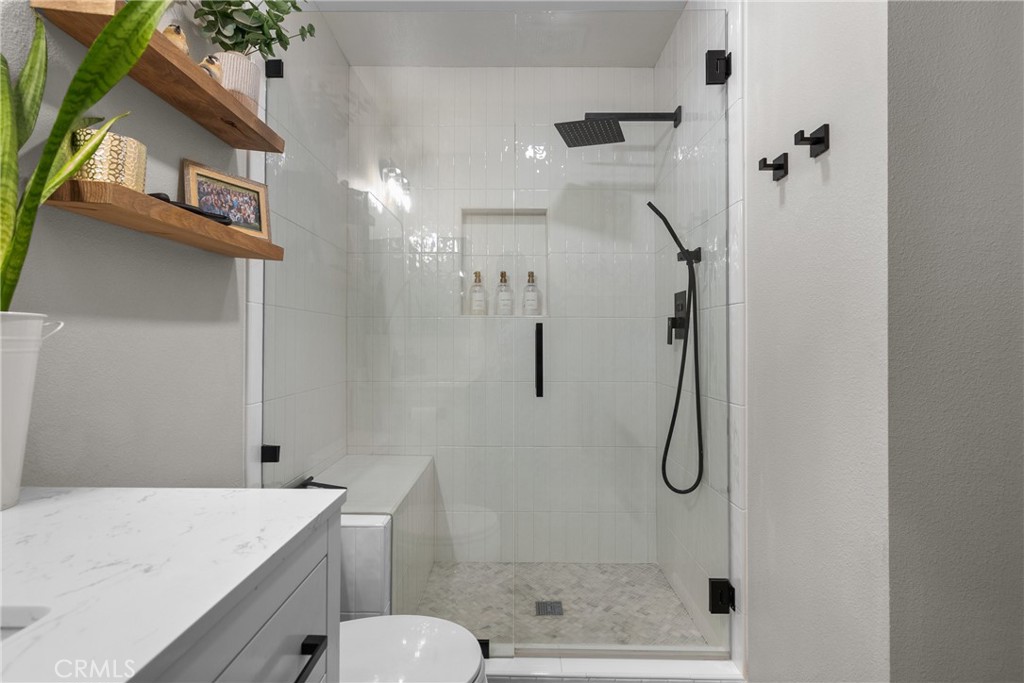 28818 Oak Springs Canyon Road Canyon Country, CA 91387 - Photo 16 of 38 a bathroom with a shower toilet and sink