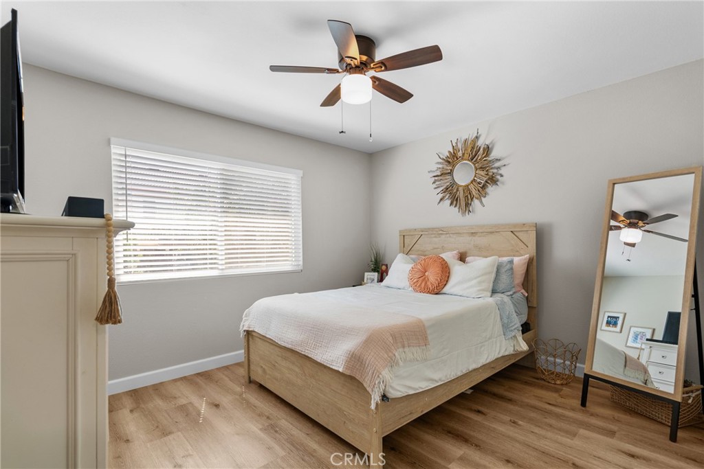 28818 Oak Springs Canyon Road Canyon Country, CA 91387 - Photo 18 of 38 a bedroom with a bed and a ceiling fan