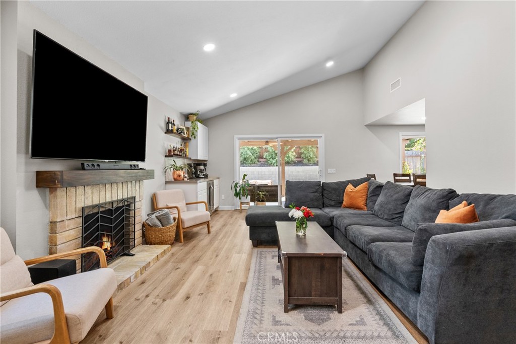28818 Oak Springs Canyon Road Canyon Country, CA 91387 - Photo 2 of 38 a living room with fireplace furniture and a flat screen tv