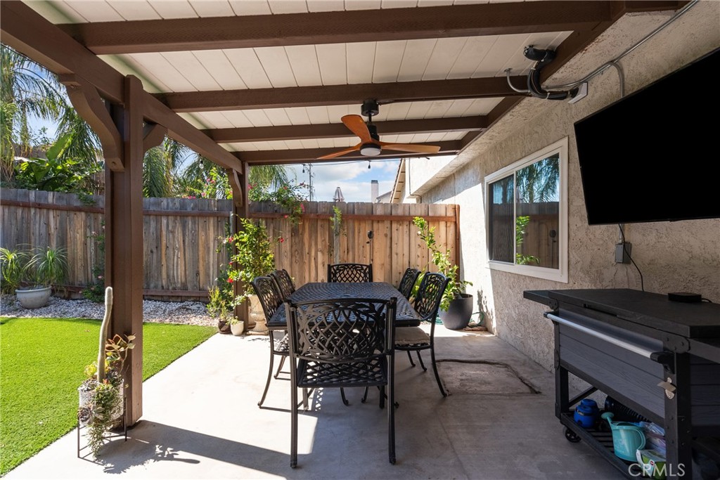 28818 Oak Springs Canyon Road Canyon Country, CA 91387 - Photo 28 of 38 a view of a patio with a table chairs and a backyard