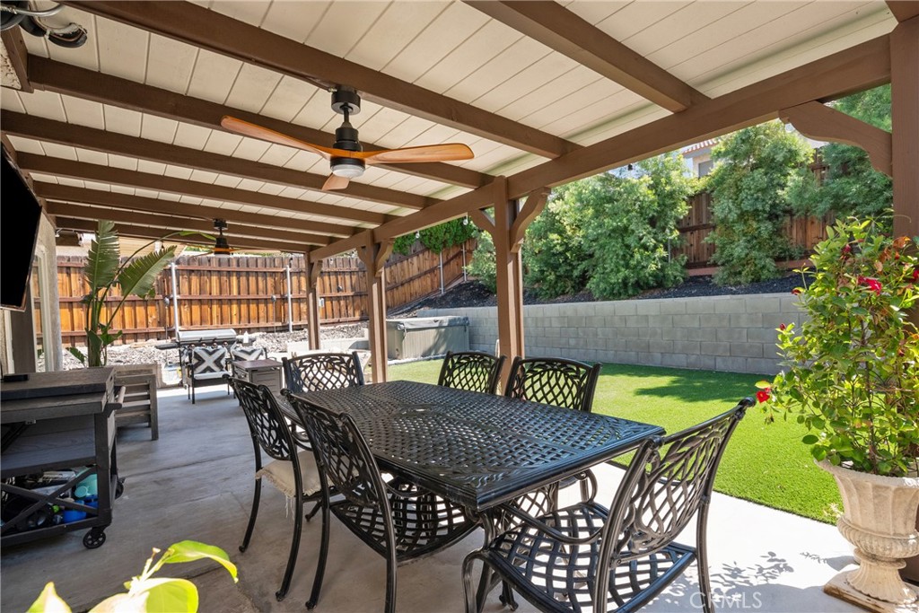 28818 Oak Springs Canyon Road Canyon Country, CA 91387 - Photo 30 of 38 a view of an outdoor dining space with furniture and wooden floor