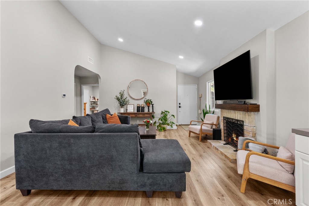 28818 Oak Springs Canyon Road Canyon Country, CA 91387 - Photo 6 of 38 a living room with fireplace furniture and a flat screen tv
