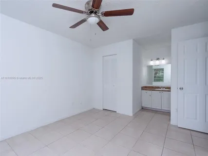 a view of a kitchen with a sink and cabinet