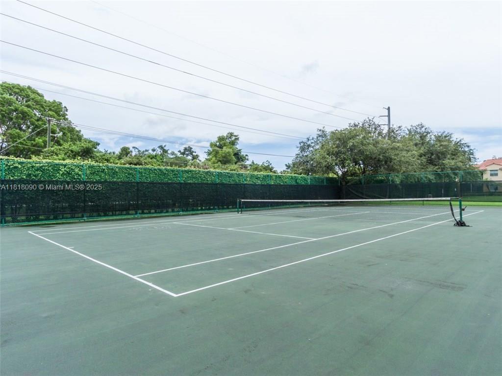1235 Southwest 46th Avenue, Unit 707 Pompano Beach, FL 33069 - Photo 8 of 15 a view of a tennis court