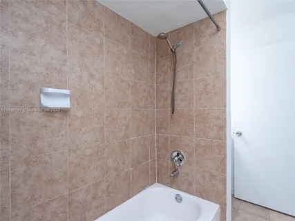 a bathroom with a shower and a toilet