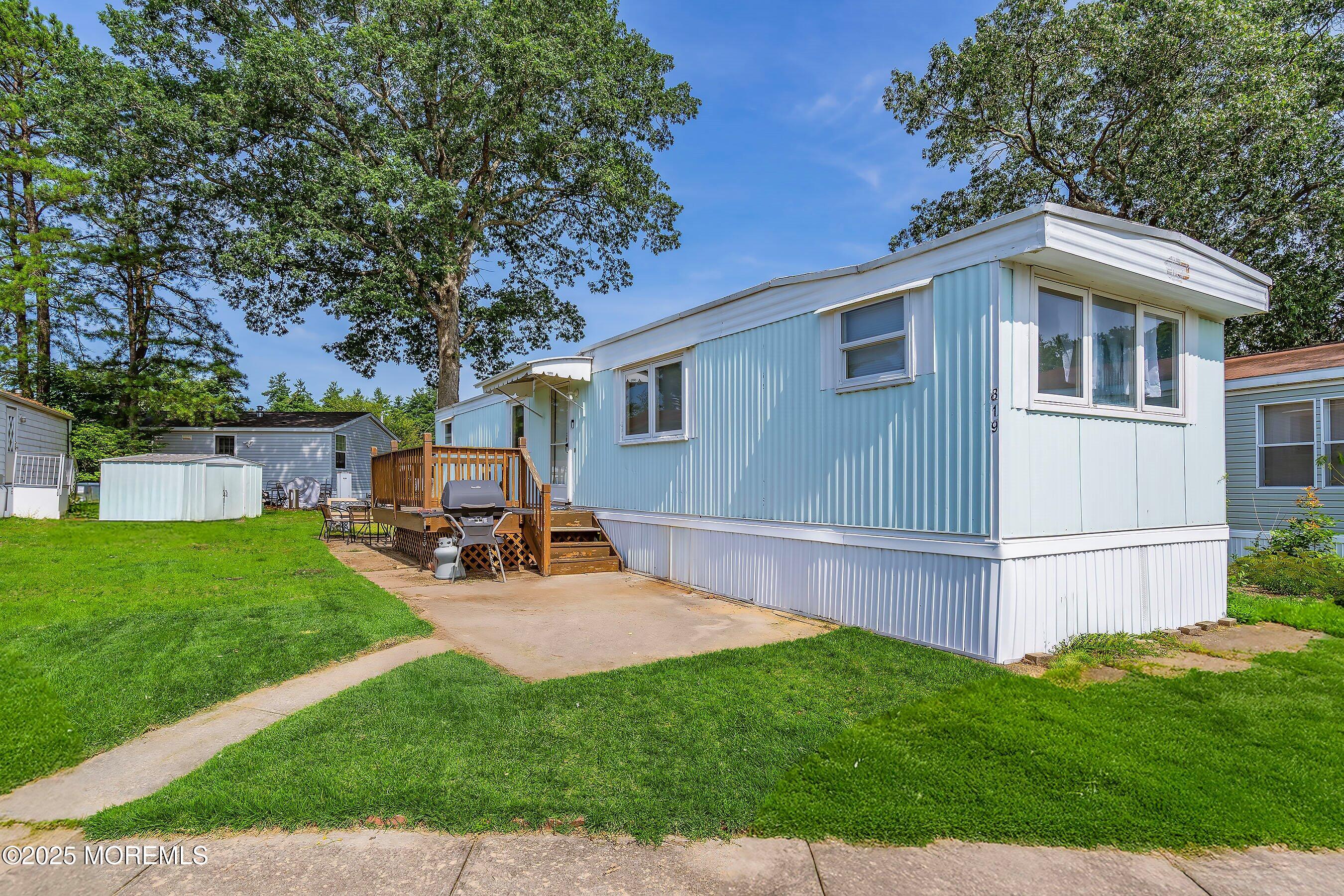 819 North Street Jackson, NJ 08527 - Photo 1 of 16 a view of backyard with house and sitting area