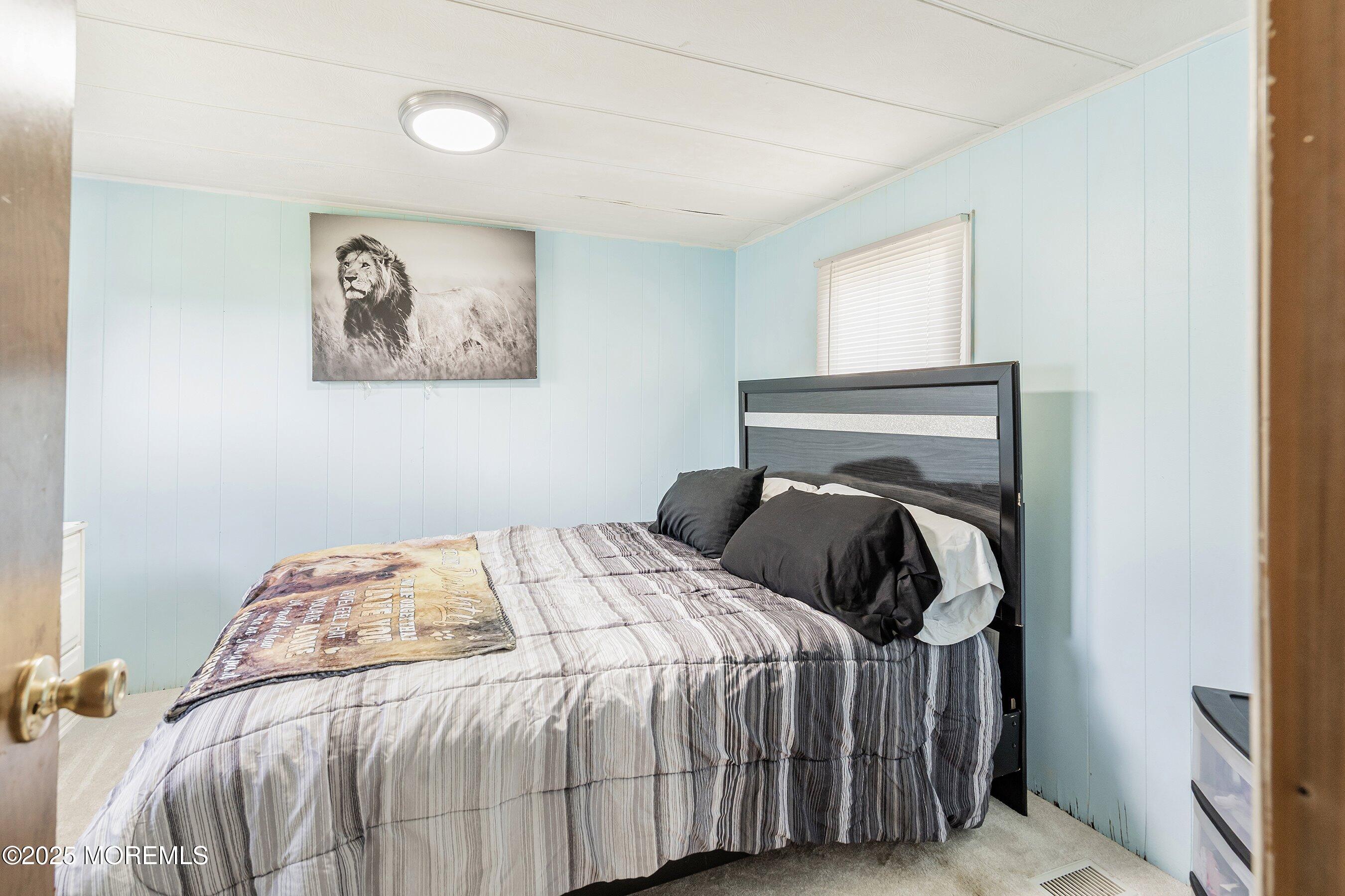 819 North Street Jackson, NJ 08527 - Photo 12 of 16 a bedroom with a bed and a window