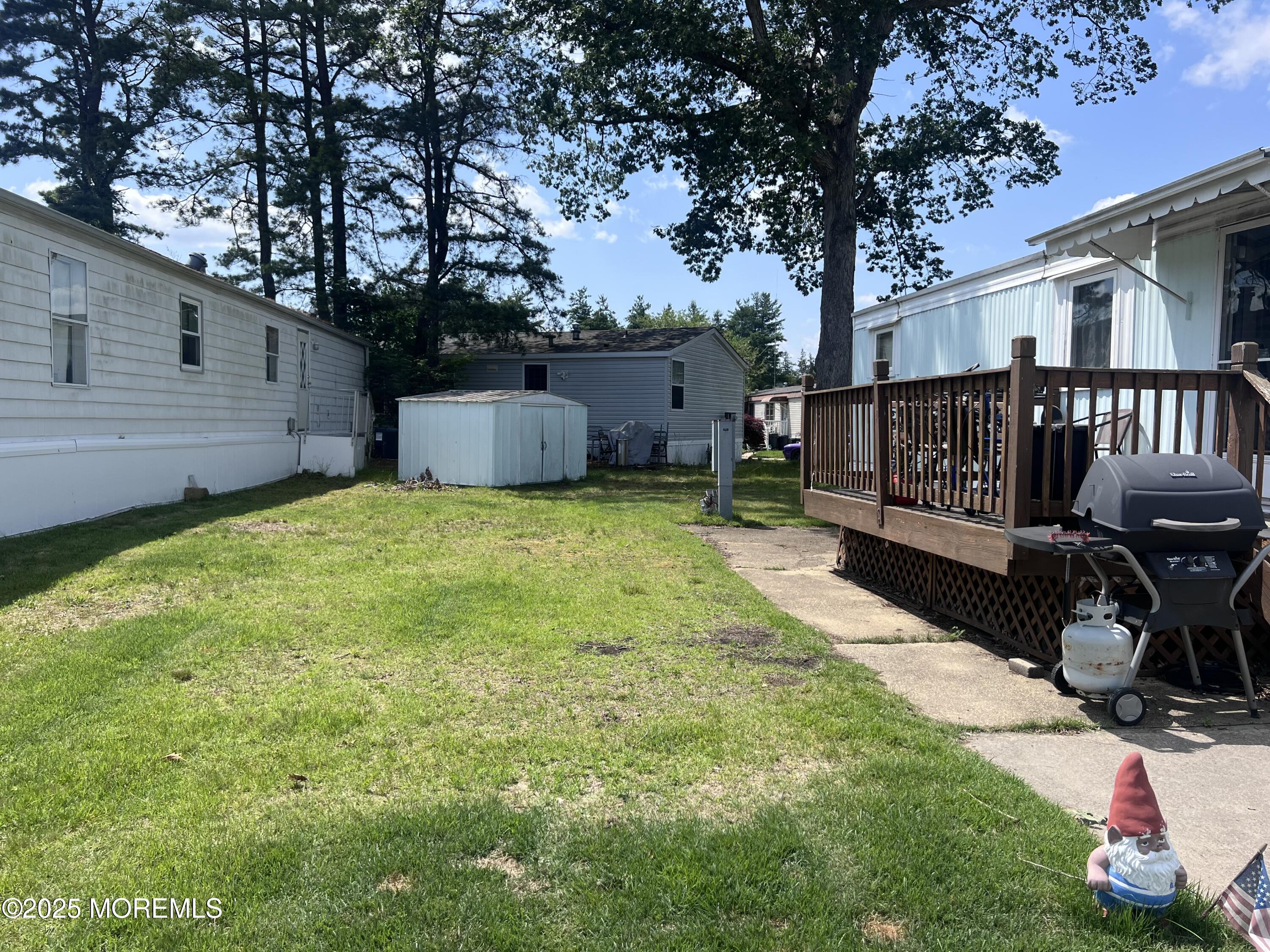 819 North Street Jackson, NJ 08527 - Photo 4 of 16 a view of a backyard with a garden