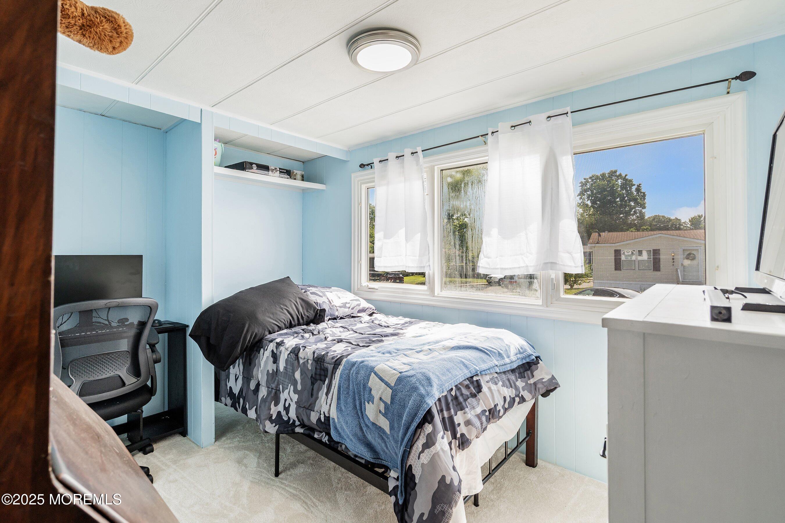 819 North Street Jackson, NJ 08527 - Photo 10 of 16 a bedroom with a bed and a window