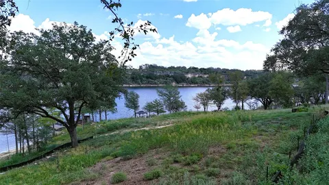 a view of a lake with a building in the background