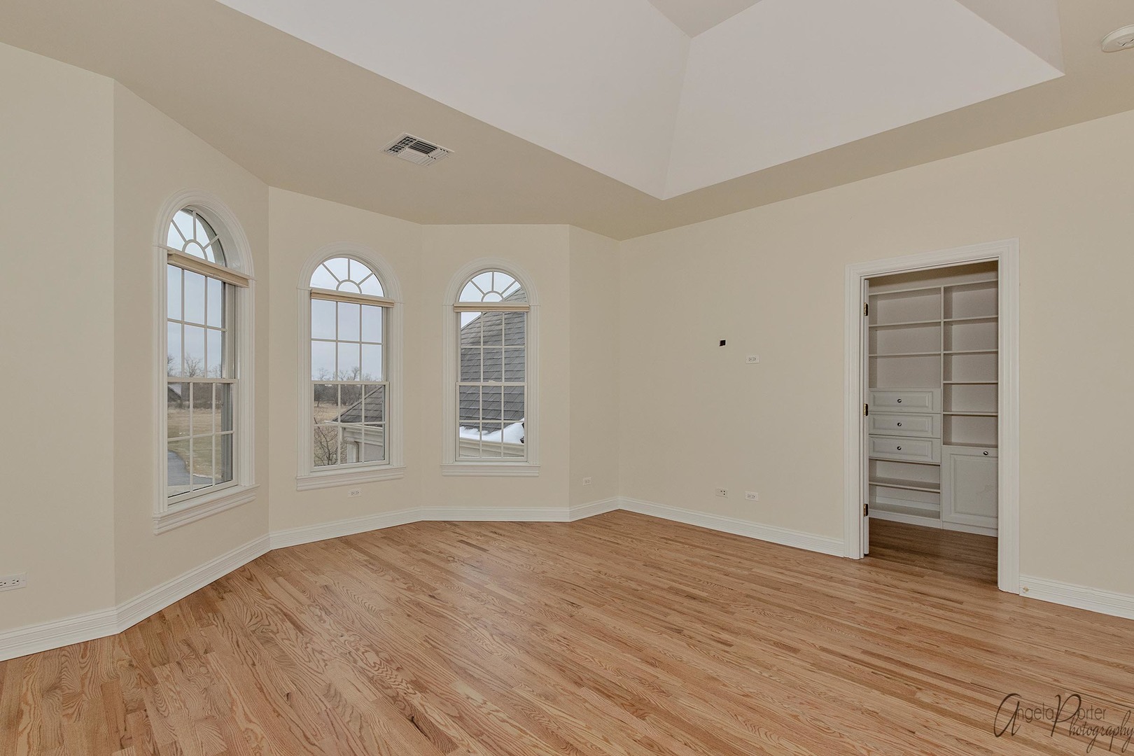 3513 Deep Wood Drive Crystal Lake, IL 60012 - Photo 34 of 71 an empty room with wooden floor and windows