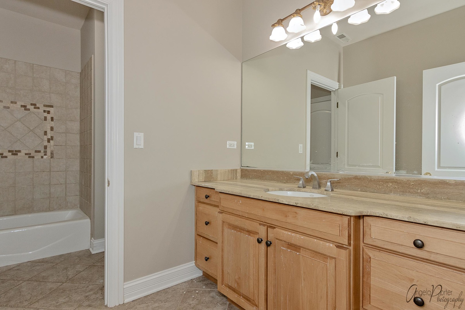 3513 Deep Wood Drive Crystal Lake, IL 60012 - Photo 36 of 71 a bathroom with a granite countertop sink a mirror and a shower