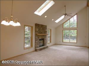 1408 Ridge Road Pocono Lake, PA 18347 - Photo 2 of 5 a view of an empty room with a window and fireplace