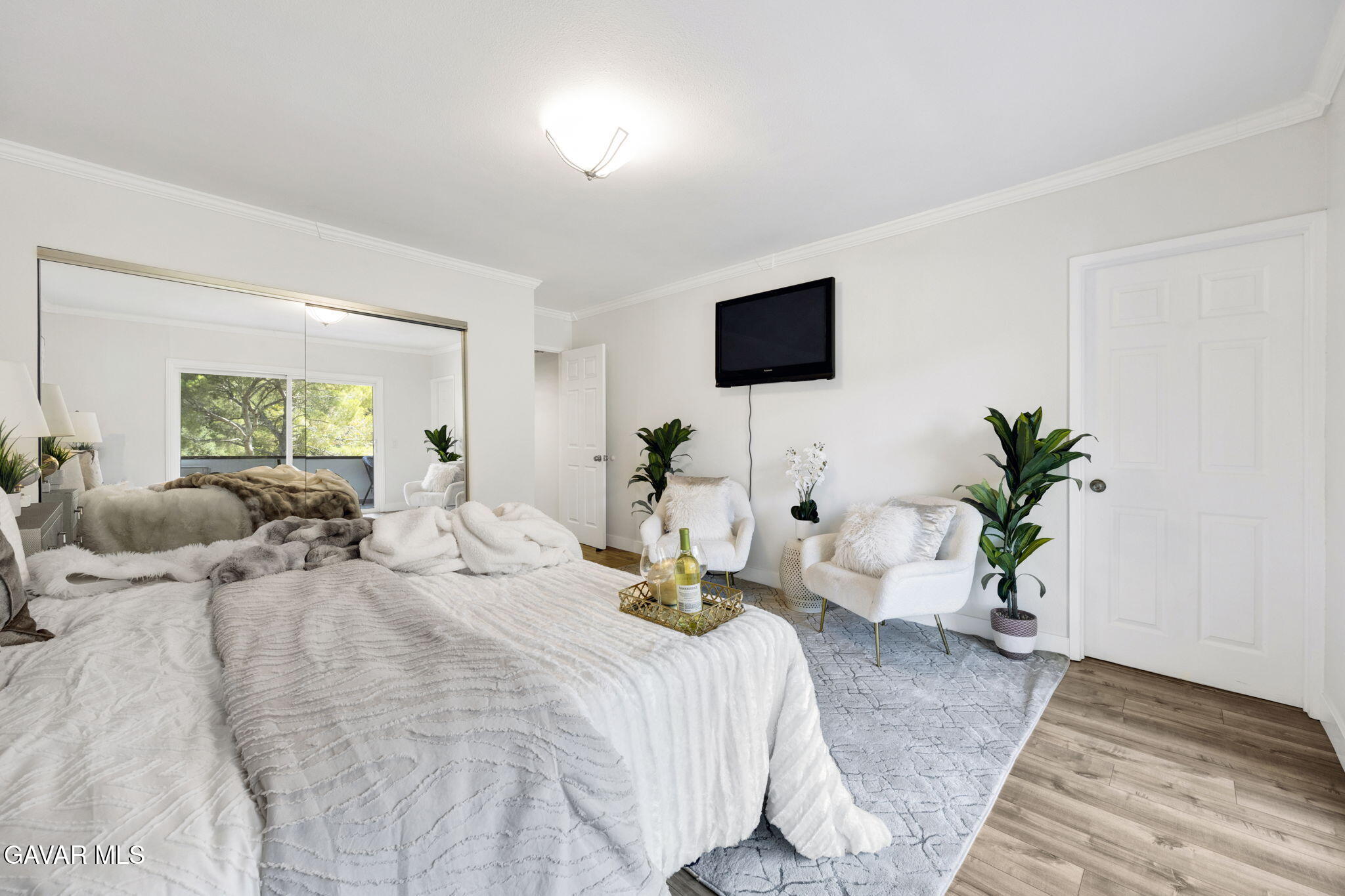 1935 Alpha Road, Unit 112 Glendale, CA 91208 - Photo 11 of 23 a bedroom with a bed a couch and potted plant