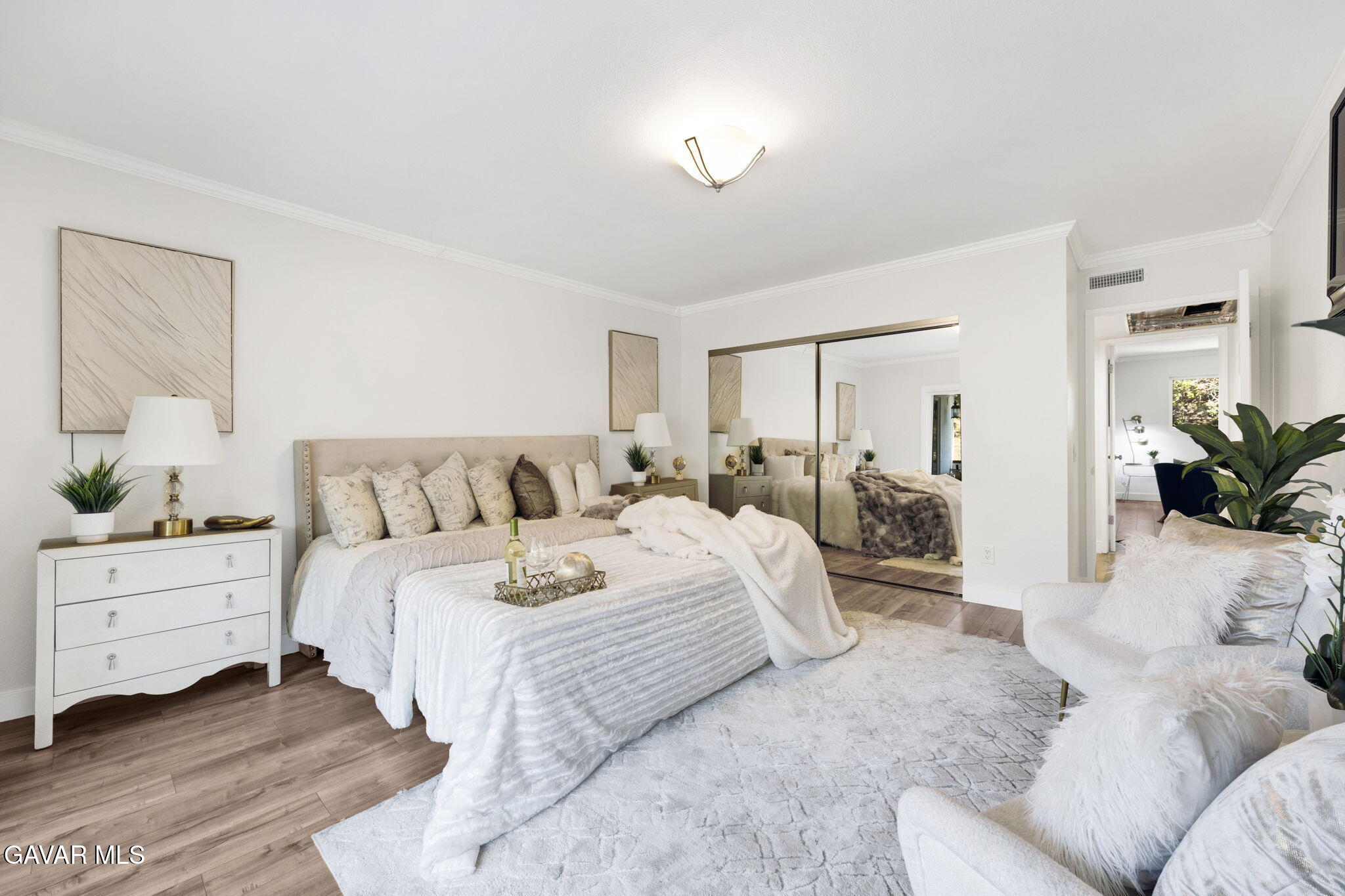 1935 Alpha Road, Unit 112 Glendale, CA 91208 - Photo 12 of 23 a living room with furniture and a potted plant