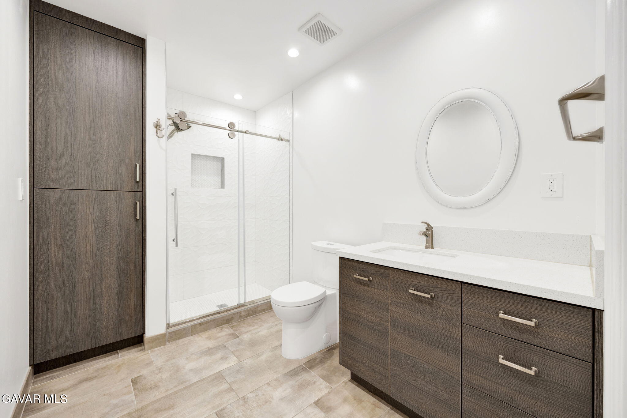 1935 Alpha Road, Unit 112 Glendale, CA 91208 - Photo 13 of 23 a bathroom with a toilet sink and mirror
