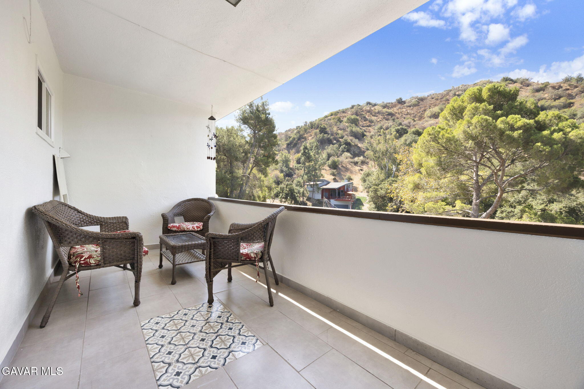 1935 Alpha Road, Unit 112 Glendale, CA 91208 - Photo 14 of 23 a balcony with table and chairs