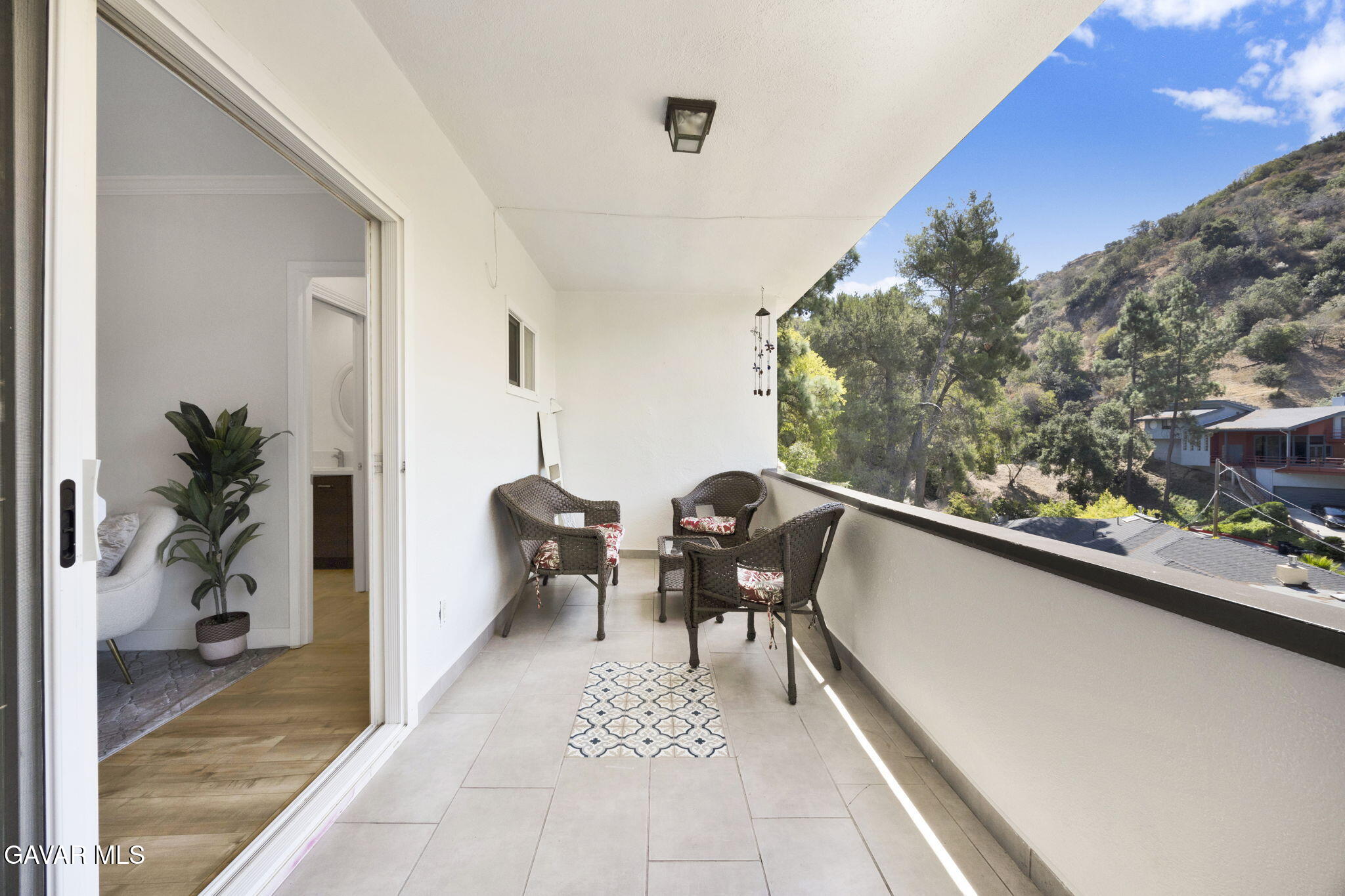 1935 Alpha Road, Unit 112 Glendale, CA 91208 - Photo 15 of 23 a balcony with furniture and a potted plant