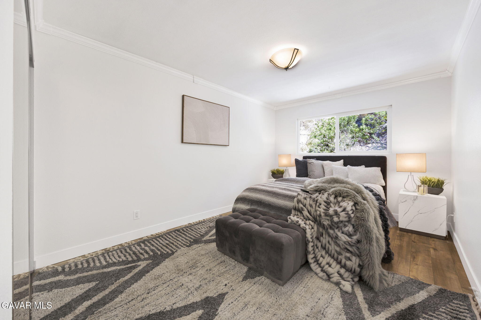 1935 Alpha Road, Unit 112 Glendale, CA 91208 - Photo 16 of 23 a bedroom with a bed and window