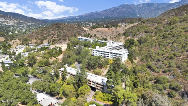 a view of a street with a building in the background