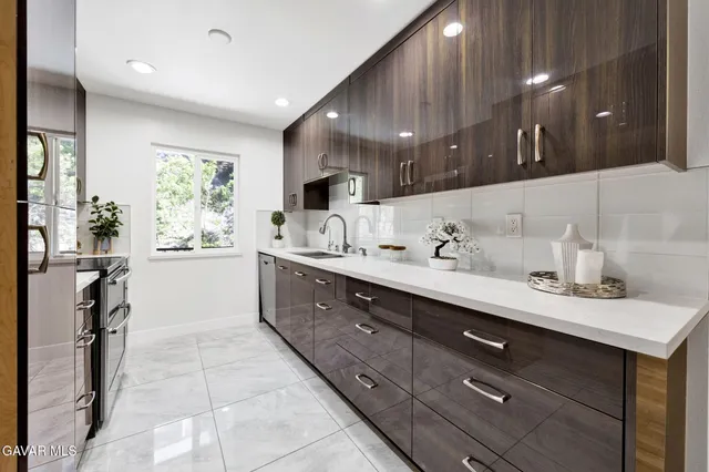 a spacious bathroom with a double vanity sink a mirror and a shower