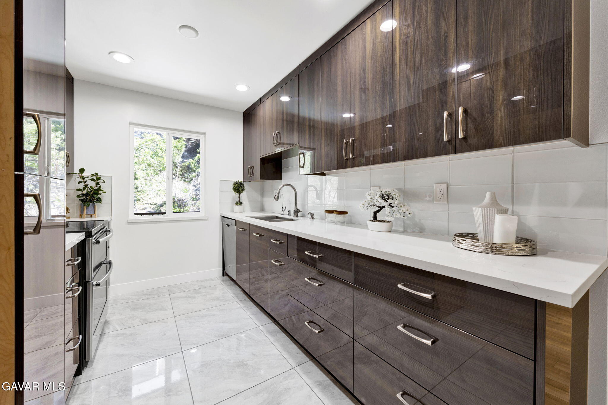 1935 Alpha Road, Unit 112 Glendale, CA 91208 - Photo 3 of 23 a spacious bathroom with a double vanity sink a mirror and a shower