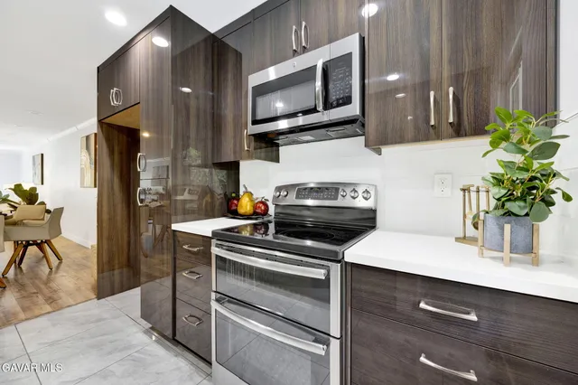 a kitchen with a stove and a microwave