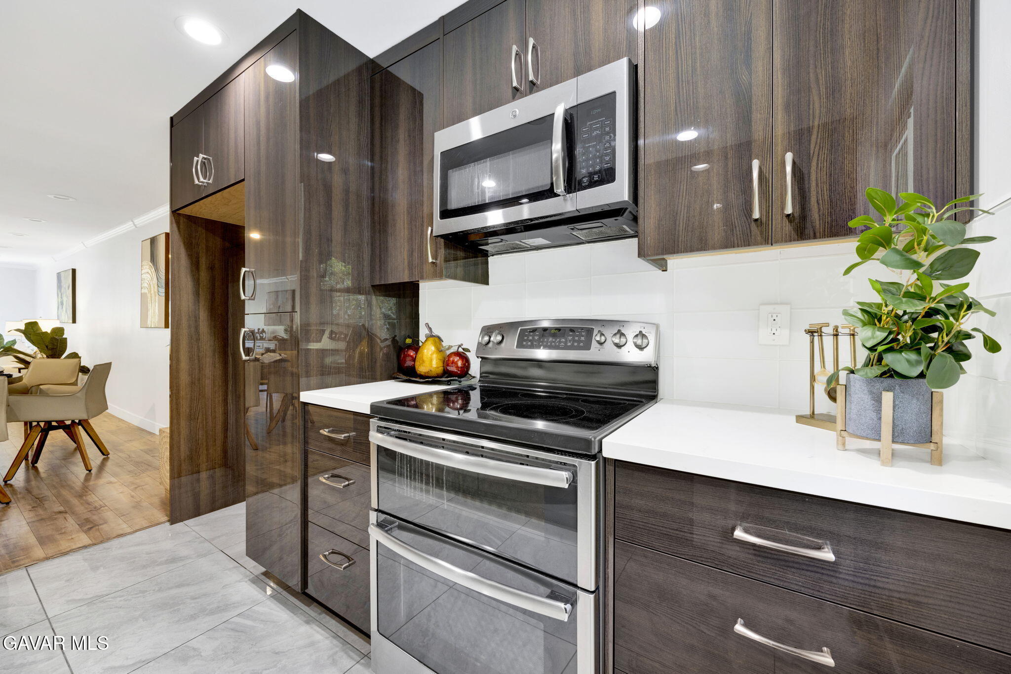 1935 Alpha Road, Unit 112 Glendale, CA 91208 - Photo 5 of 23 a kitchen with a stove and a microwave